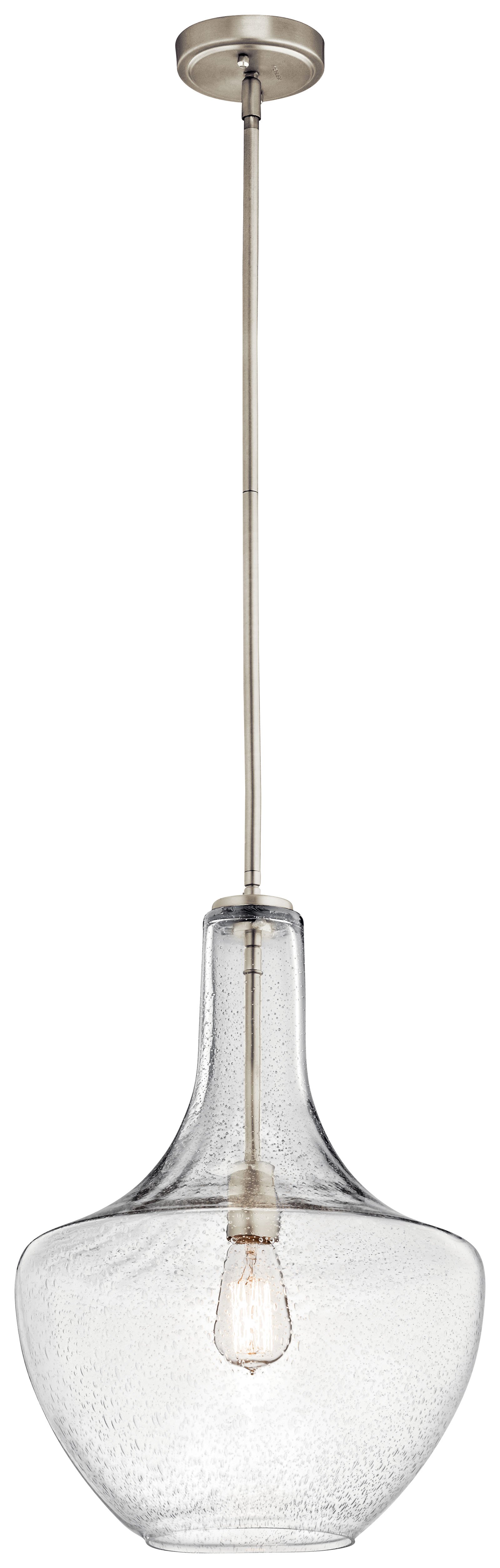 The design of this 1 light pendant from Everly collection is based on decorative blown glass containers. It features clear seedy glass and is made memorable with the use of vintage squirrel cage filament lamps. Contemporary or traditional, this pendant can be used singularly or in multiples to elevate every room.
