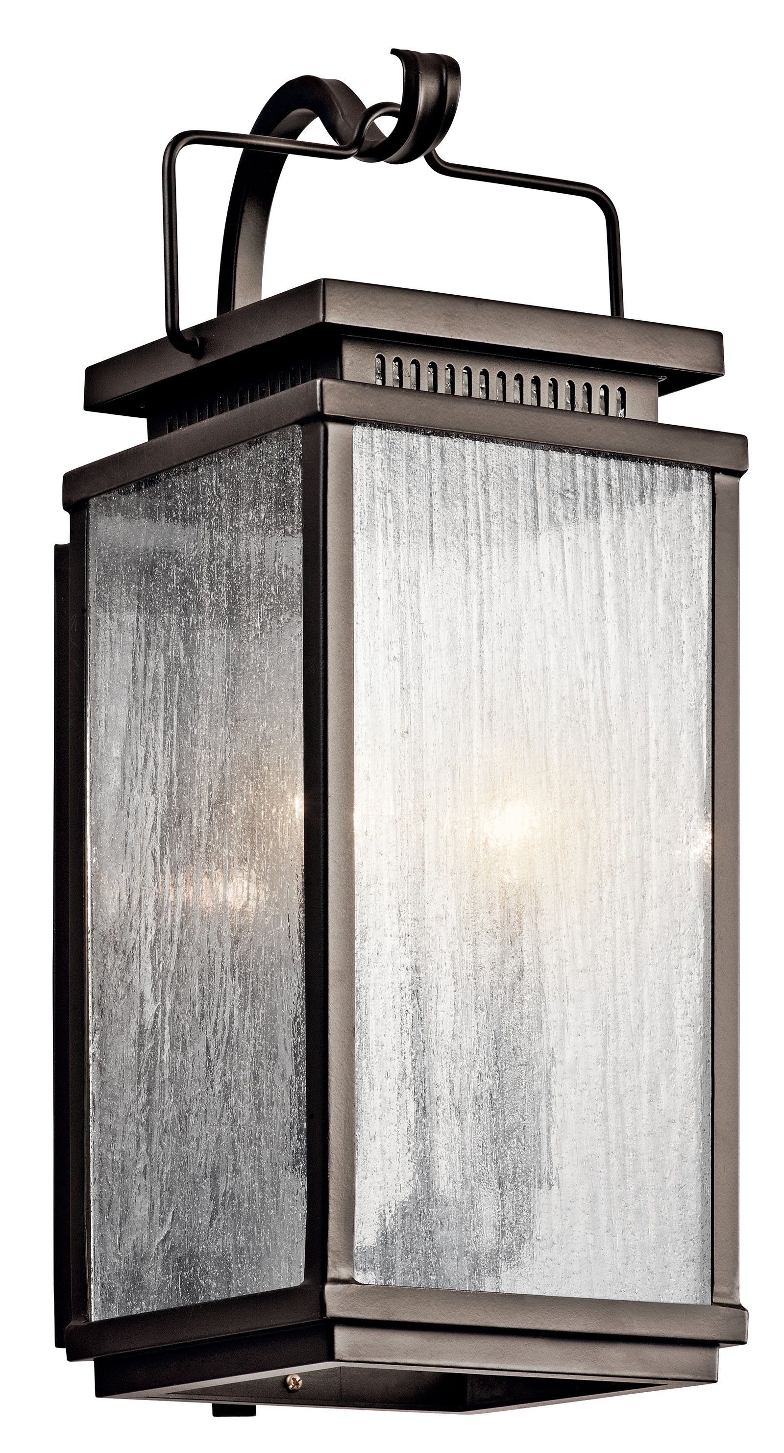 You'll love the traditional elements of this 2 light outdoor wall fixture from the Manningham(TM) collection. The Clear Seedy glass partners with the strong lines and detailed cap accents in Olde Bronze creating a colonial inspired illuminating dream for  the outside of your home.