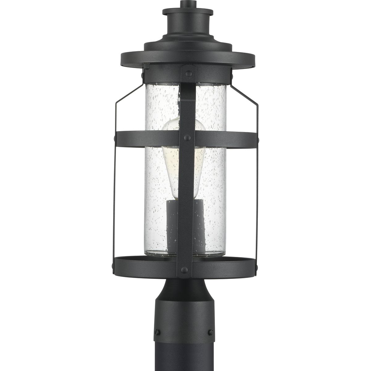 The one-light post lantern in the Haslett Collection features a design with intersecting linear details that surrounds clear seeded glass and finished in Black. Coastal-inspired frame is suitable to complement architecture with Farmhouse flair.