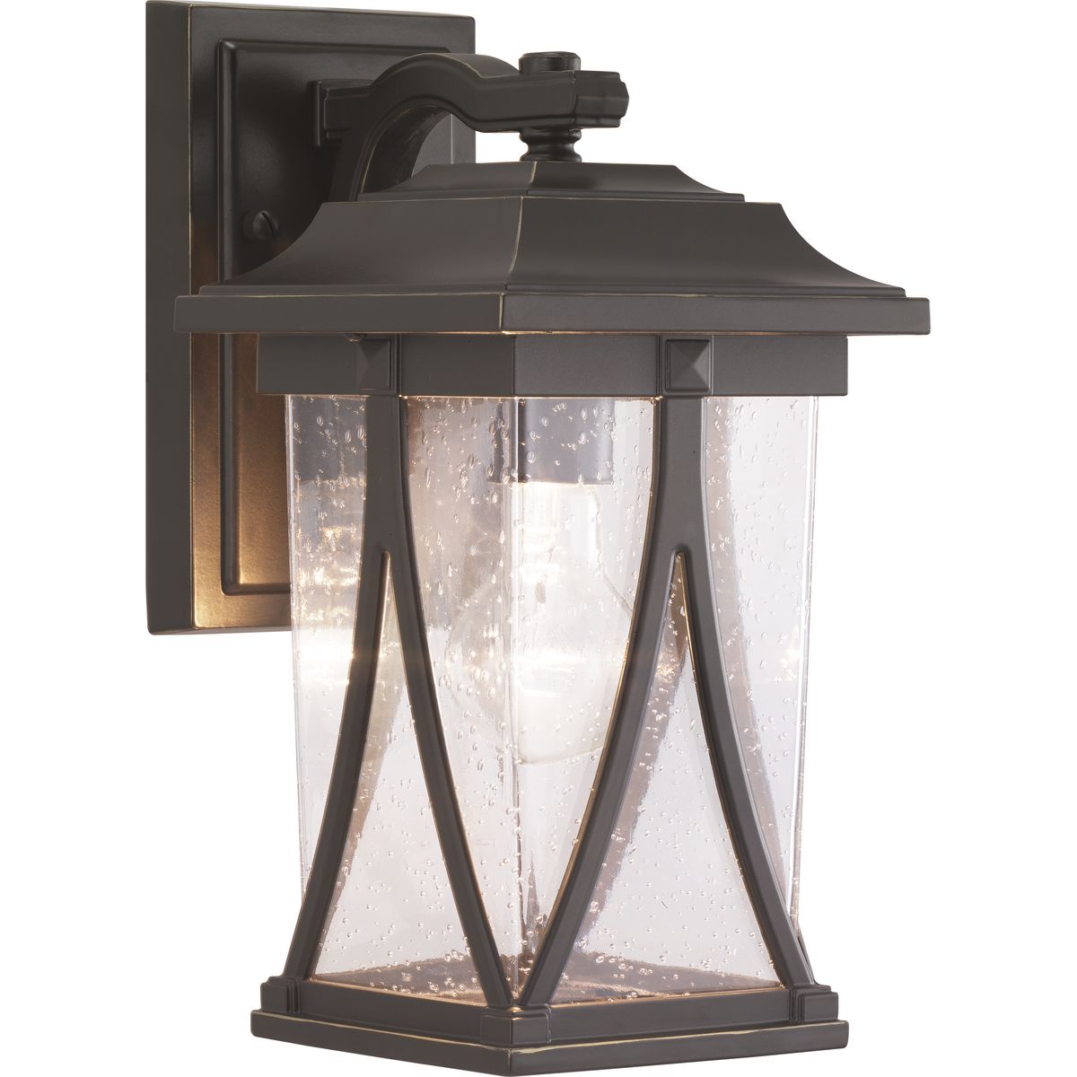 Distinctive forms with ancient roots are featured in this small wall lantern from the Abbott Collection. Transparency, depth and dimension are all on display to highlight the clear seeded glass and sweeping details within the Antique Bronze frame.