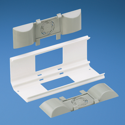 Product image for Panduit WCM35BFIW Backfeed fitting. Inserts allow cable entry and exit through the back of the raceway and conduit. Breakouts include 1/2", 3/4", and 1" .