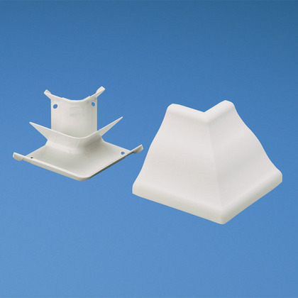 Product image for Panduit WCM35OCIW Outside corner fitting. Used to join cove raceway at outside corners. Maintains a minimum 1" bend radius of cabling.