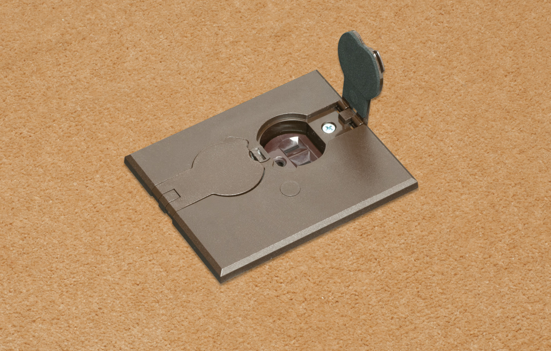 Non Metallic adjustable floor box. Brown with flip lids. Includes tamper resistant duplex receptacle, rectangular cover plate with gasket and Arlington NM94 connector and Arlington NM900 knockout plug.