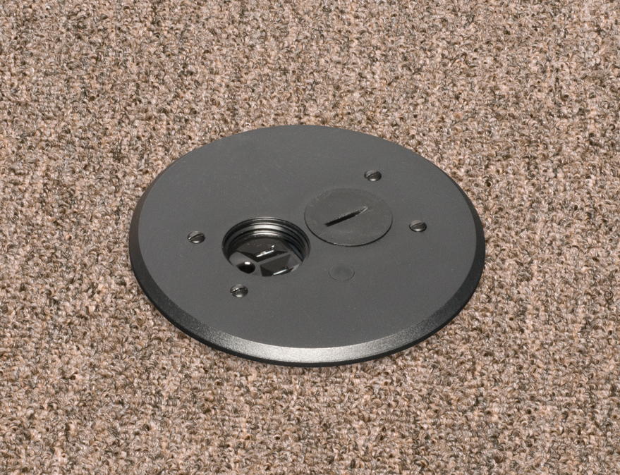 Round Non Metallic adjustable floor box. Black with threaded plugs. Includes tamper resistant duplex receptacle, cover plate with gasket and Arlington NM94 connector and Arlington NM900 knockout plug.