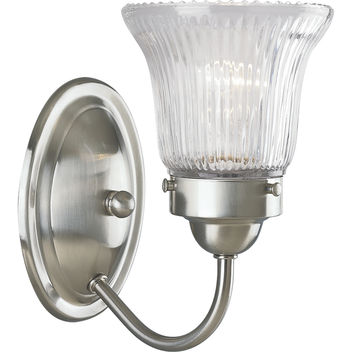 Fluted Glass 1-light bath fixture in a Brushed Nickel finish. Classic metallic fixture is paired with sparkling clear prismatic glass. Timeless in its vintage appeal, this light is stylish for both new and restored homes.