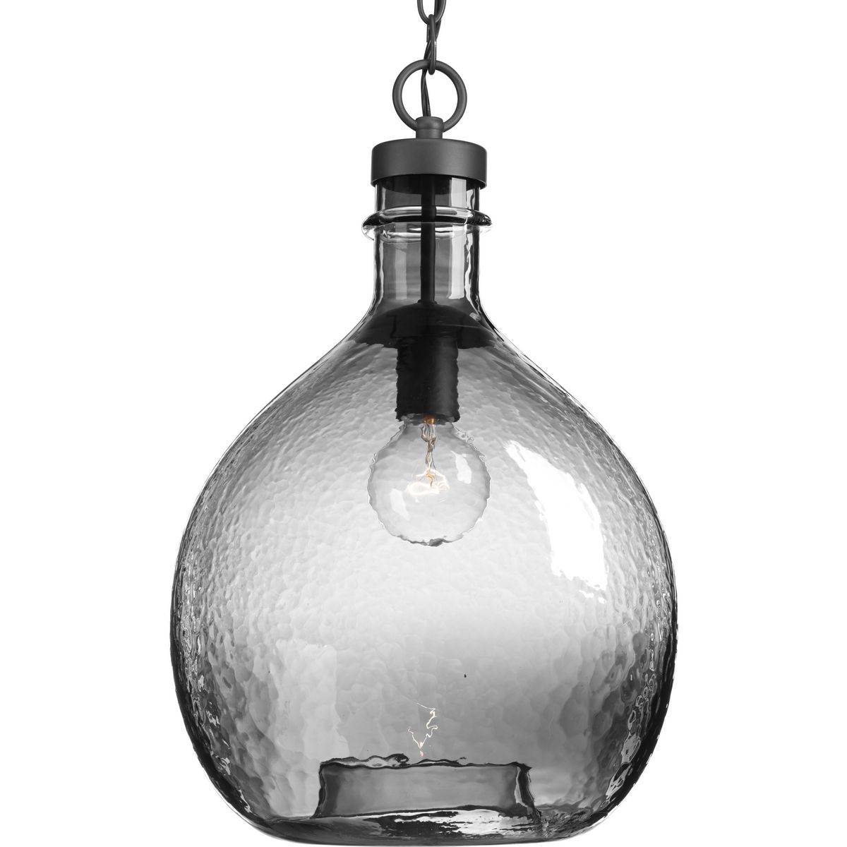 Inspired by a beautiful wine cask design, the Zin pendants are artfully formed from one large piece of glass. The one-light pendant has a graphite finish with solid, rich smoke-colored glass. Create a customized look for Rustic Farmhouse and Modern Farmhouse to Urban Industrial settings by grouping several pendants together in a kitchen, entryway or living room setting. Perfectly imperfect, the design offers dimension and visual texture.