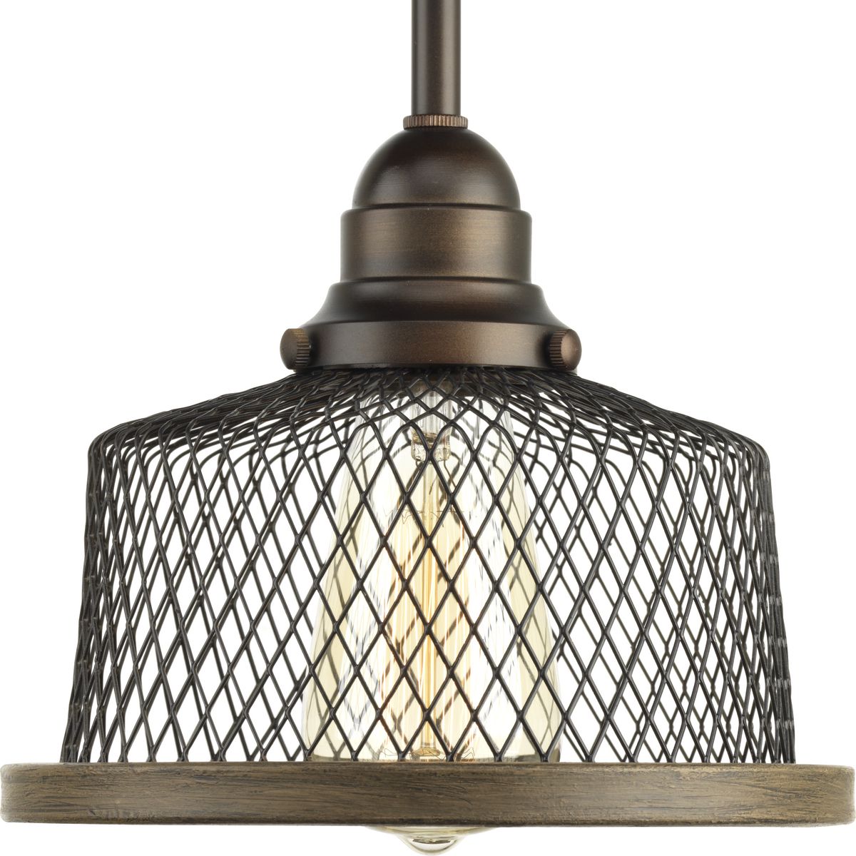 Rustic and vintage decor is a popular trend that can transform a home into a nostalgic retreat. Tilley features warehouse style shades formed from metal mesh that merge with a faux-painted, wooden rim for an artful yet industrial style. One-light mini-pendant in a Antique Bronze finish.