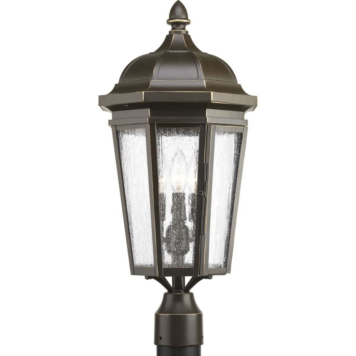 The three-light post lantern in the Verdae collection offers traditional styling for a variety of exteriors. Classic and formal clear seeded glass complements an Antique Bronze finish. Fits 3 in post (order separately). Hinged door for easy access to replace lamps.
