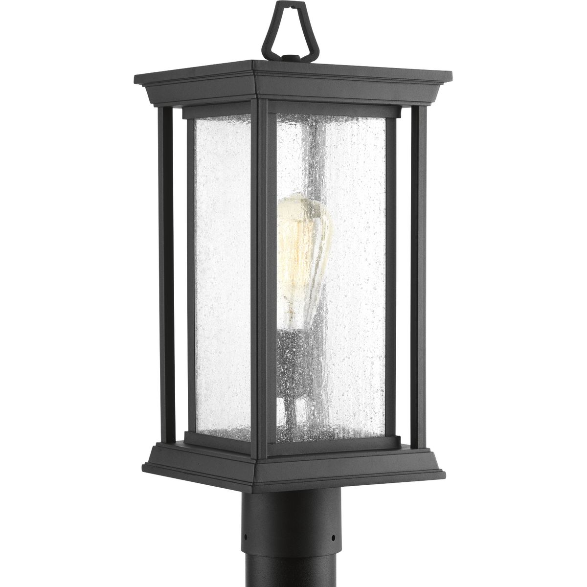 One-Light post lantern with a Craftsman-inspired silhouette, Endicott offers visual interest to your home's exterior. The elongated frame is finished with clear seeded glass.