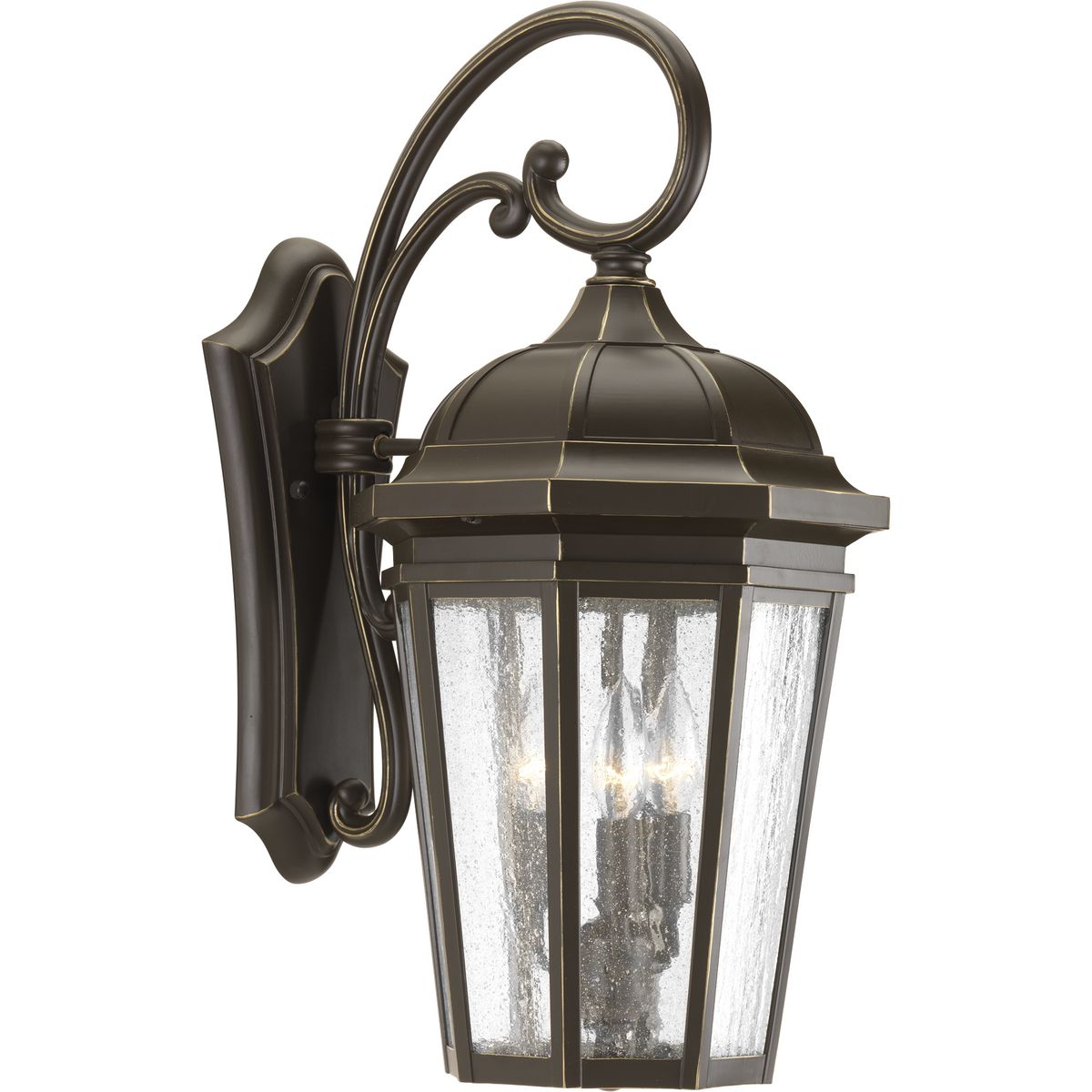 The three-light wall lantern in the Verdae collection offers traditional styling for a variety of exteriors. Classic and formal clear seeded glass complements an Antique Bronze finish. Open bottom design allows easy access to replace lamps.