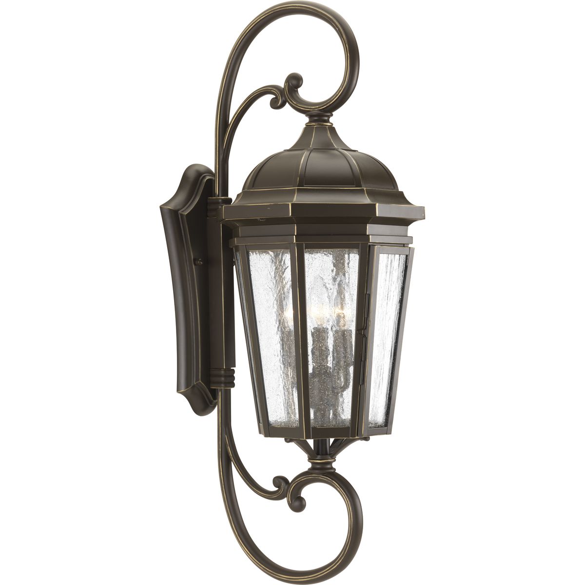 The three-light wall lantern in the Verdae collection offers traditional styling for a variety of exteriors. Classic and formal clear seeded glass complements an Antique Bronze finish. Hinged door for easy access to replace lamps.