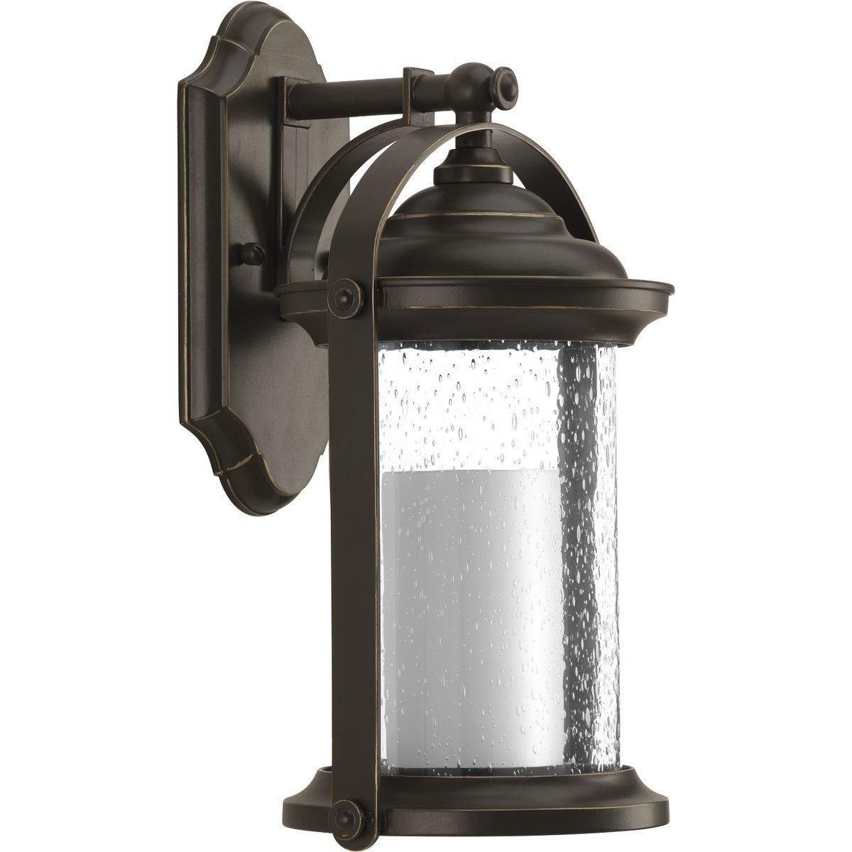 Inspired by traditional lantern styles, Whitacre small wall lantern incorporates handsome details. Clear seeded glass surrounds an etched opal glass candle diffuser. An Antique Bronze finish complements a variety of exteriors, including Transitional and Traditional and Farmhouse designs.