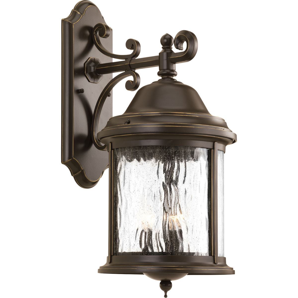 Inspired by lanterns from the Old World, the Ashmore collection incorporates handsome details, quill-scrolled arms and decorative finials. The water seeded glass is in a die-cast aluminum frame. Three-light 9-5/8 in wall lantern in an Antique Bronze finish.