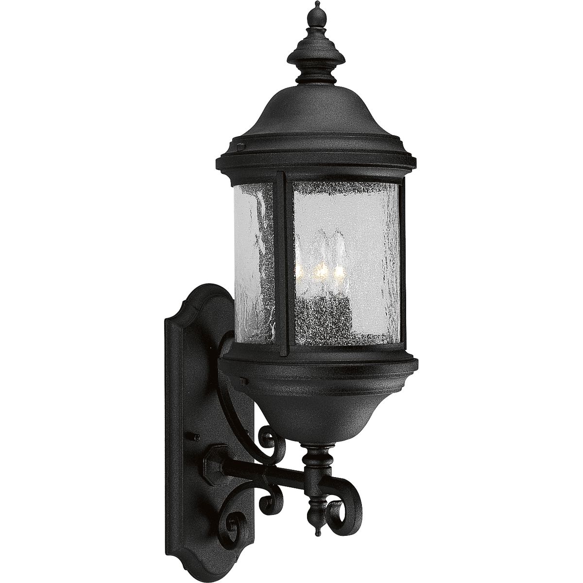 Inspired by lanterns from the Old World, the Ashmore collection incorporates handsome details, quill-scrolled arms and decorative finials. The water seeded glass is in a die-cast aluminum frame. Three-light bottom mount 8-5/8 in wall lantern in a Textured Black finish.