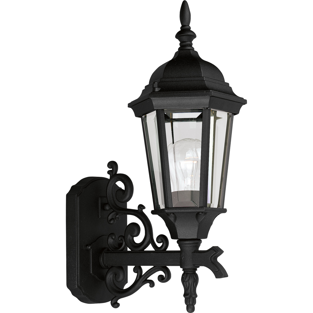 The Welbourne collection features hexagonal framework with vine inspired scrolls and clear beveled glass panels. Cast aluminum construction with durable powder coat finish. One-light 6-1/2 in bottom mount outdoor wall lantern in a Black finish.