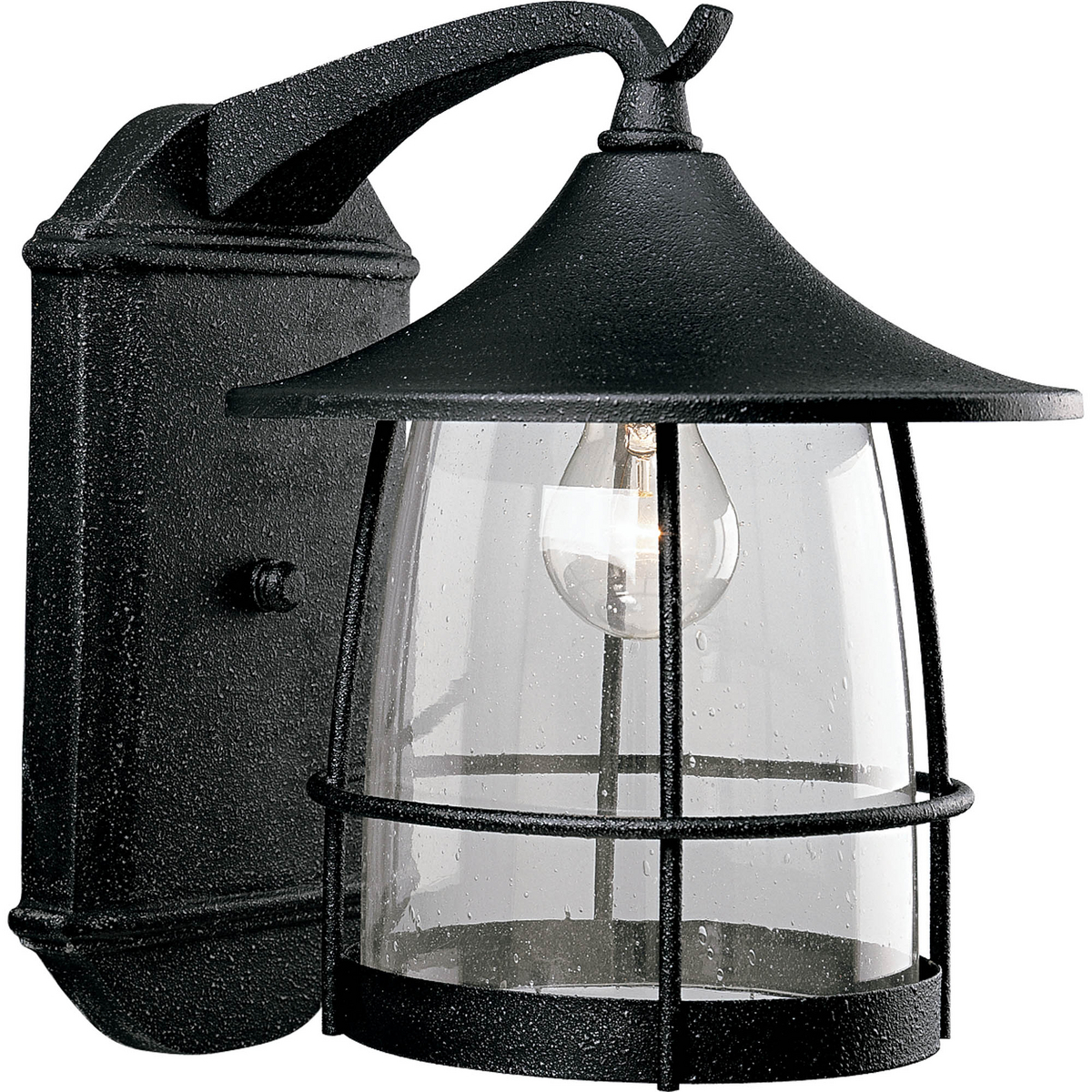 Unique cantilevered arms, distinctive roof and wire frames surround clear seeded glass. Aluminum and Brass construction. One-light large wall lantern. Gilded Iron finish.
