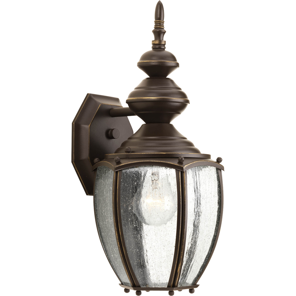Solid one-light 7 in medium wall lantern in rich weathered finish is complemented by seeded glass panels - a great choice for low maintenance and years of enjoyment. Antique Bronze finish.