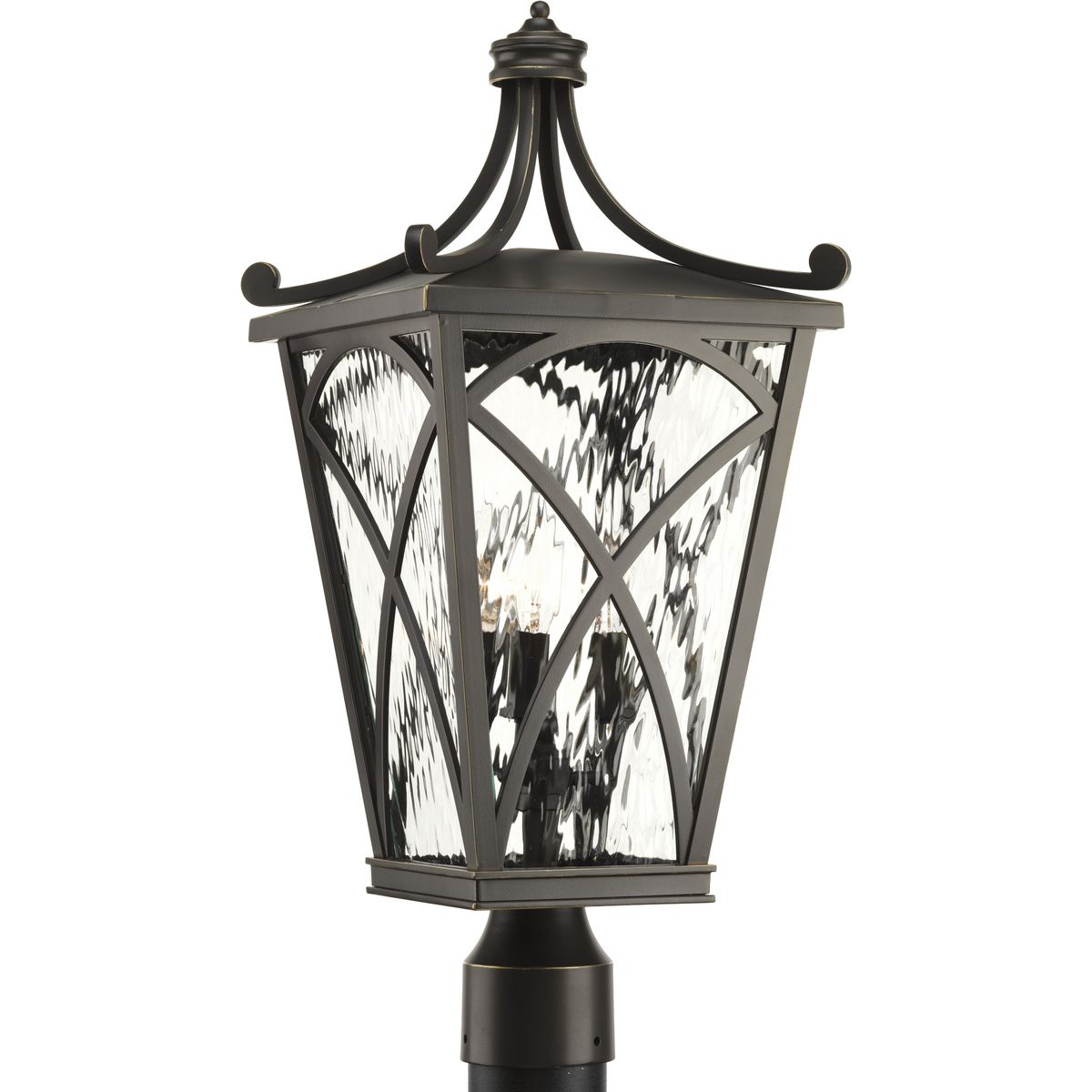 The Cadence three-light post lantern showcases classic styling with clear water glass panels and traditional lighted clusters. Mediterranean-style frame is finished in Oil Rubbed Bronze. Fits 3 in post (order separately). This Design Series collection has four lantern sizes, hanging lantern and post lantern.