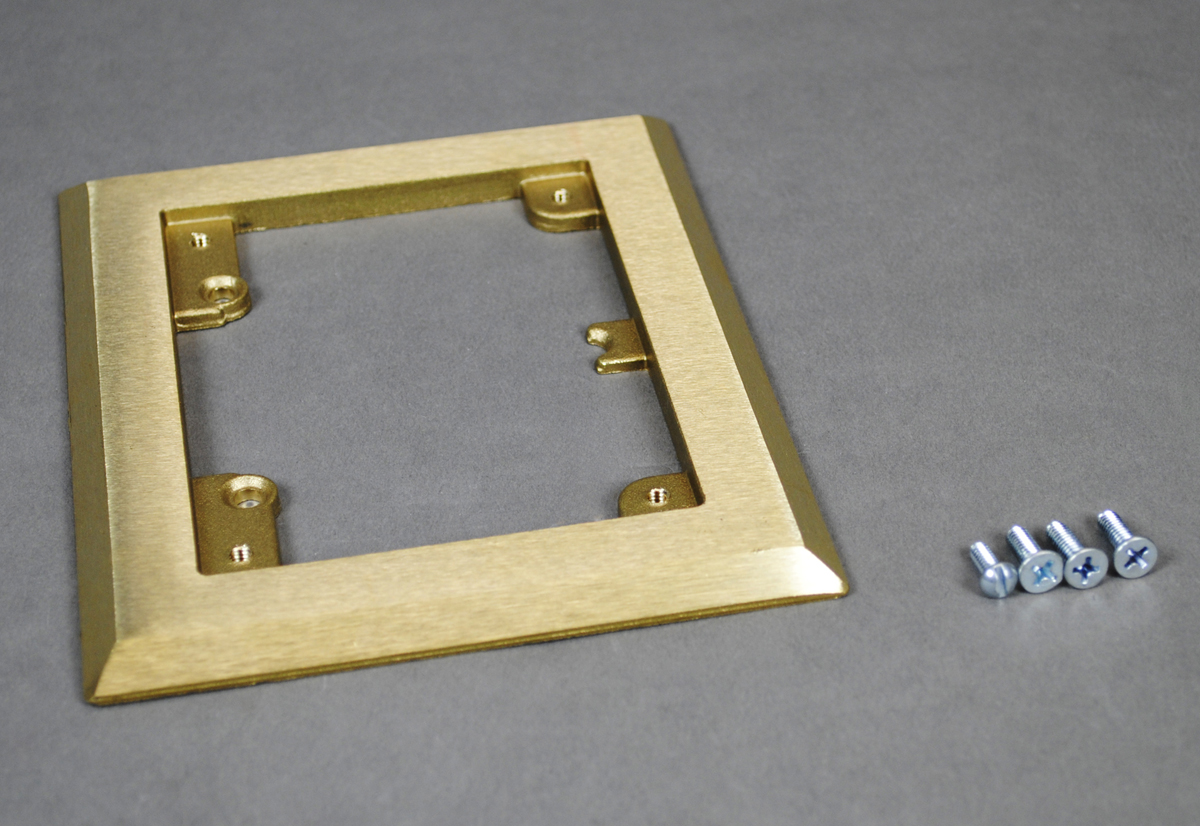 Flush brass carpet flange only with mounting screws.