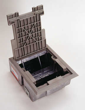 The AF3 Raised Floor and Stage Floor Box provides four separate compartments that accommodate up to eight gangs of communication, power and/or audio/ video devices. The top panel has a unique built-in service divider that accommodates a combination power, communication and audio/video devices. These dividers are arranged in a single-double, single-gang configuration. The lower panel provides single-gang activation points in a single service configuration. Die-cast aluminum housing provides added strength and reliability. Polycarbonate hinged lid and trim flange are available for carpet or tile applications, as well as a color choice of black, brown, or gray. Box with Gray Tile Cover and Trim. Finish - Gray