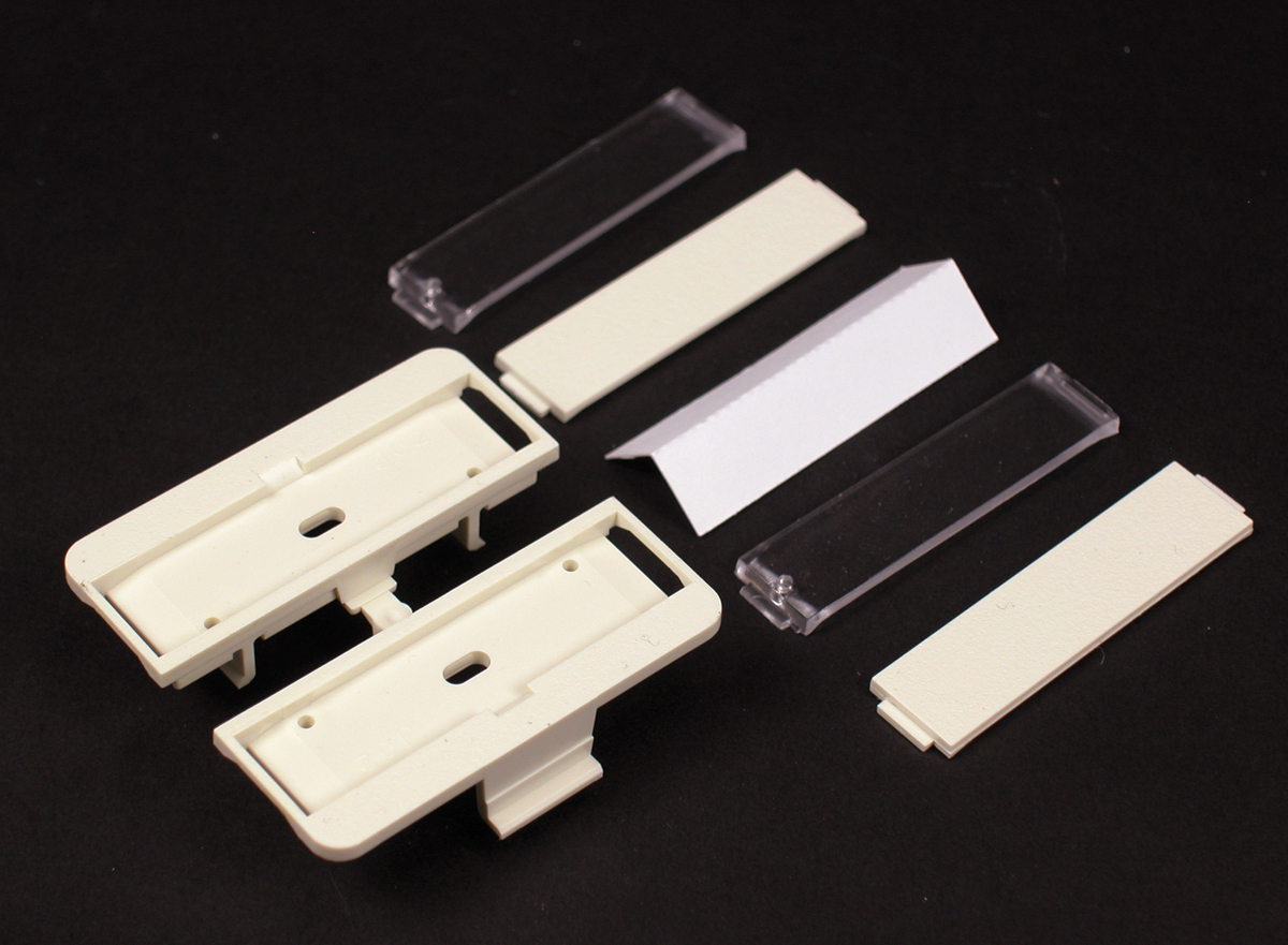 For mounting Ortronics Series II modules into 5507 opening. Includes two outlet identification labels with clear covers and two matching screw covers. Ivory