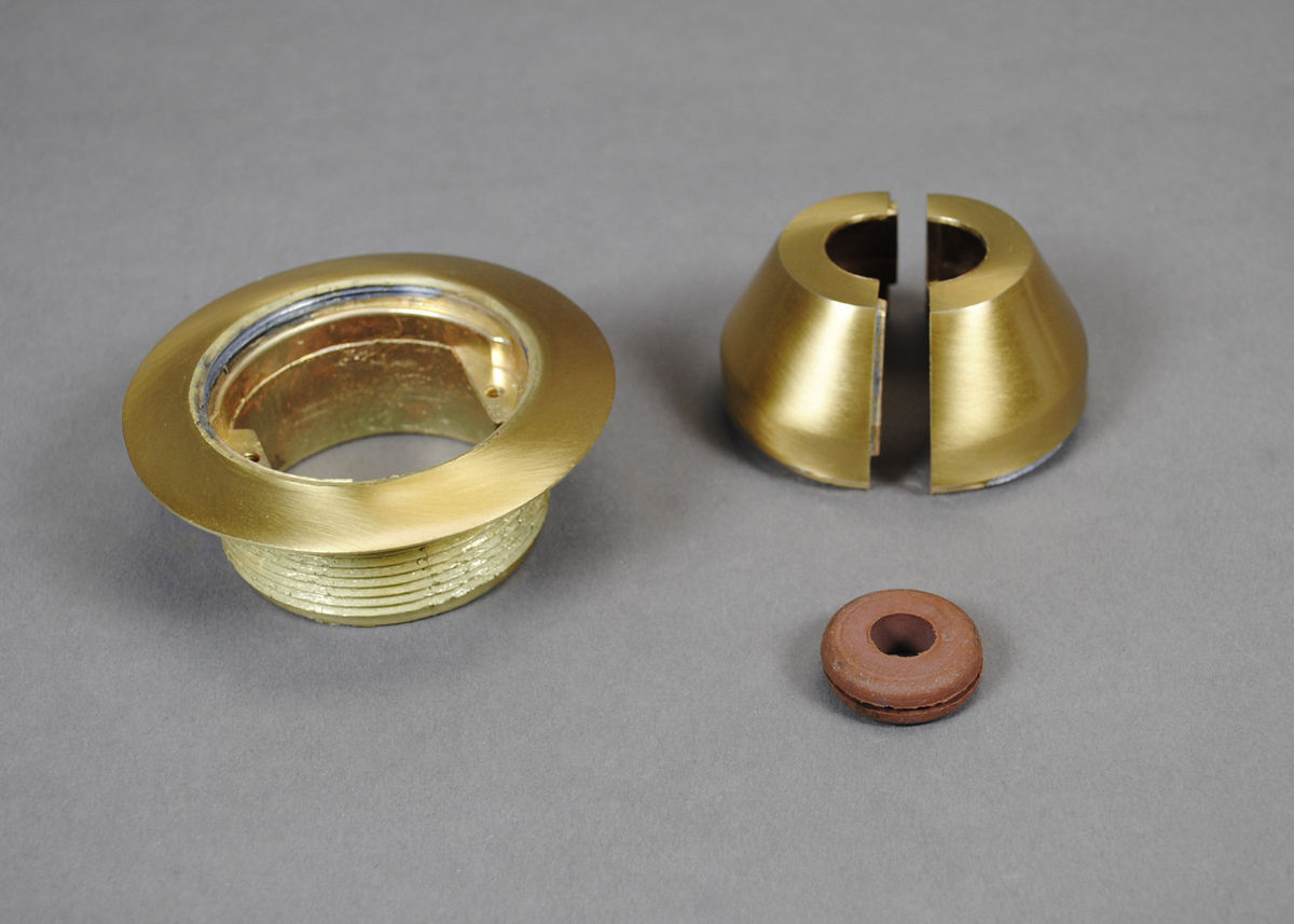 Brass finish communication fitting furnished with split bell cap and grommet. No device plate is included.