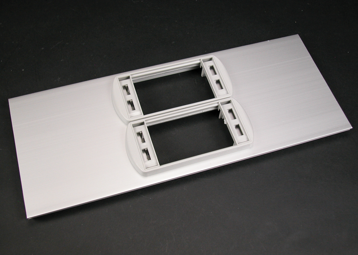 This cover plate with two low profile adapters accepts three (3) Wiremold CM2 Series communication connectivity devices. Includes cover and two low profile adapters (6A-openings). Finish - Anodized Aluminum
