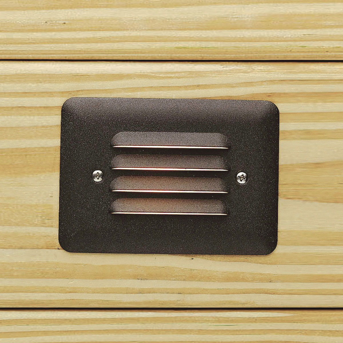 2700K WARM-WHITE LED MINI STEP LIGHT - Designed to be integrated into outdoor steps. Casts a low, even spread of energy efficient LED light. With louvered faceplate in Textured Architectural Bronze.