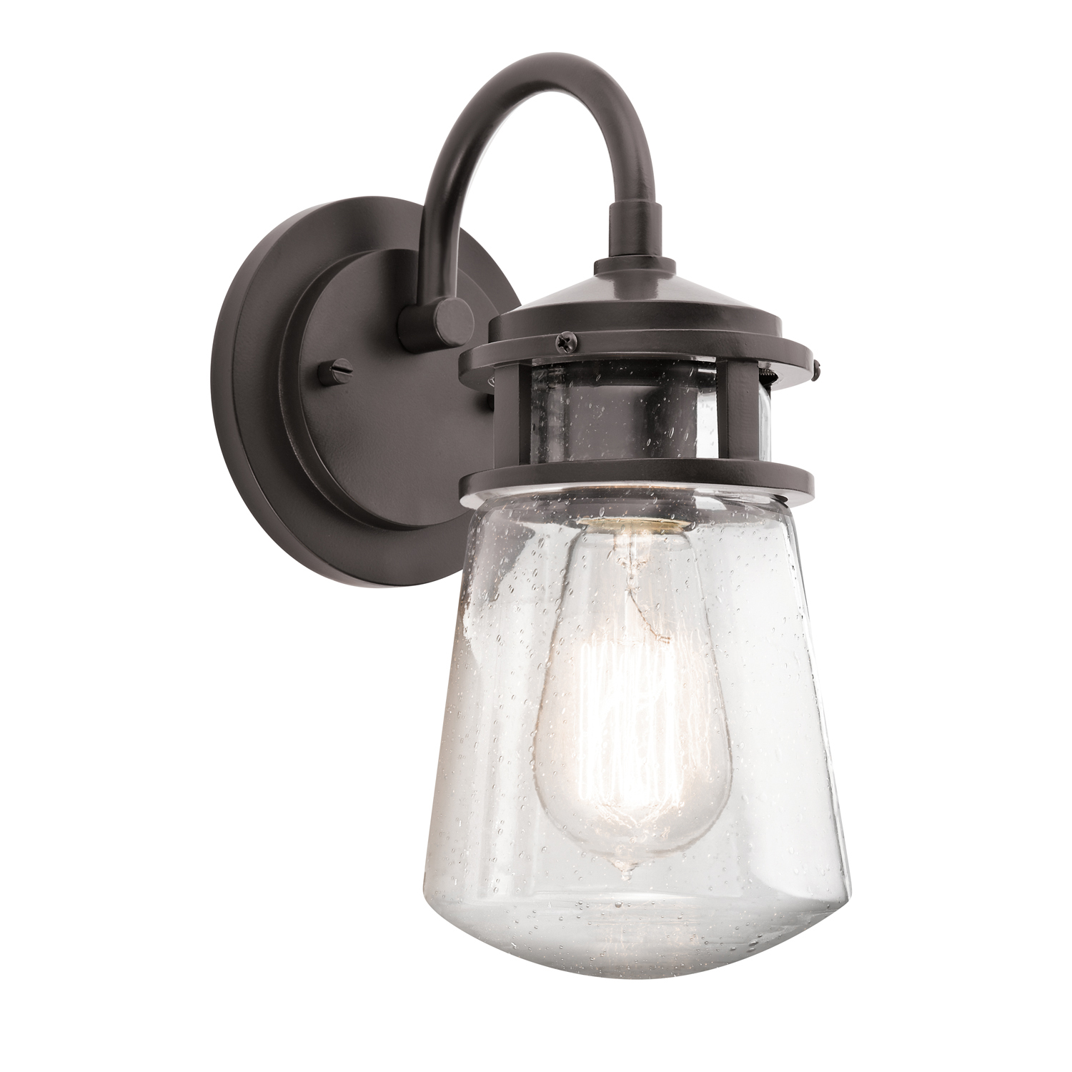 The Lyndon(TM) 11.25in. 1 light wall light features a classic look with its Architectural Bronze(TM) finish and clear seeded glass. The Lyndon(TM) wall light works in several aesthetic environments, including transitional and nautical.